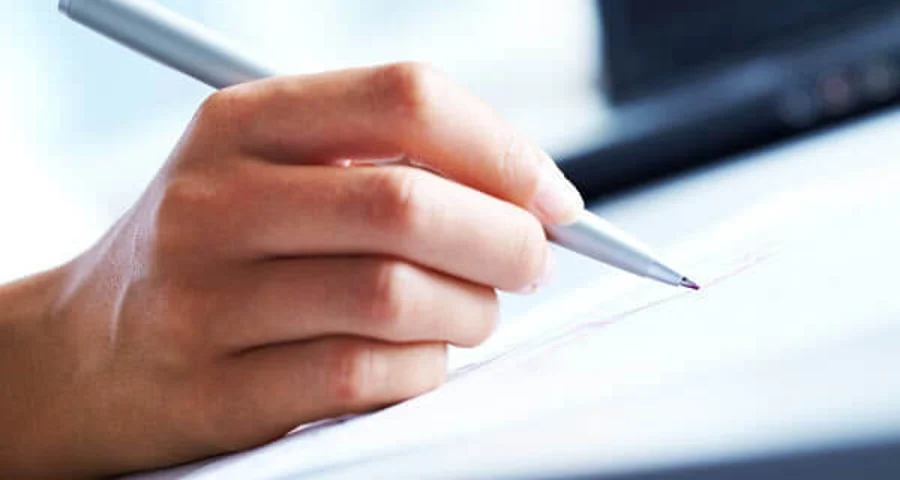 hand writing with a pen