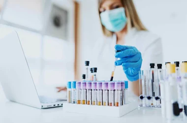 medical technician performing random drug testing in a lab