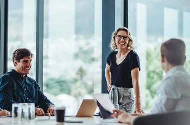 People meeting in board room and smiling