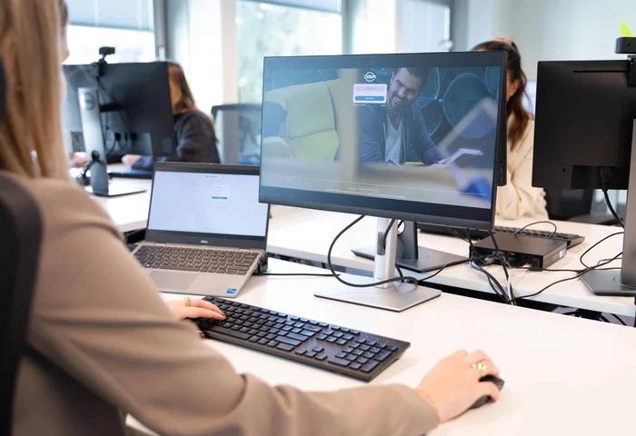 Worker at a desk logging into DISA platform