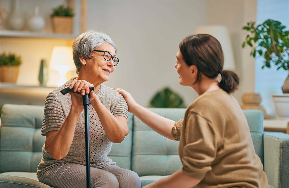 Caregiver assisting woman