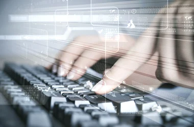 Fingers on a keyboard entering data into DISAWorks 2.0