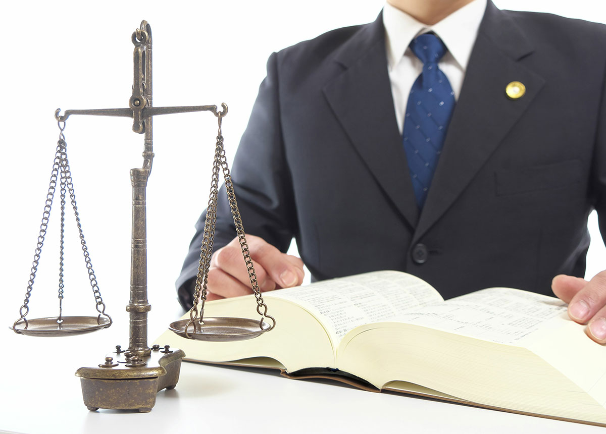 man in suit legal scales of justice