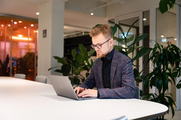 male employee sitting at a desk working
