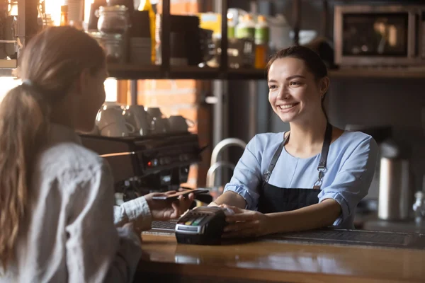 Hospitality - Retail worker accepting a payment from a customer
