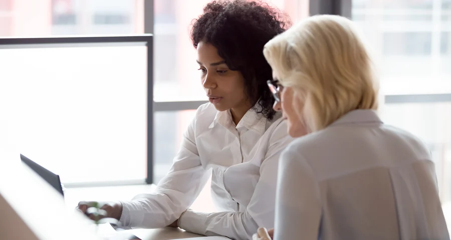 Two women in an office enviroment