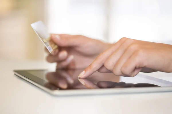 woman making online purchase with a credit card